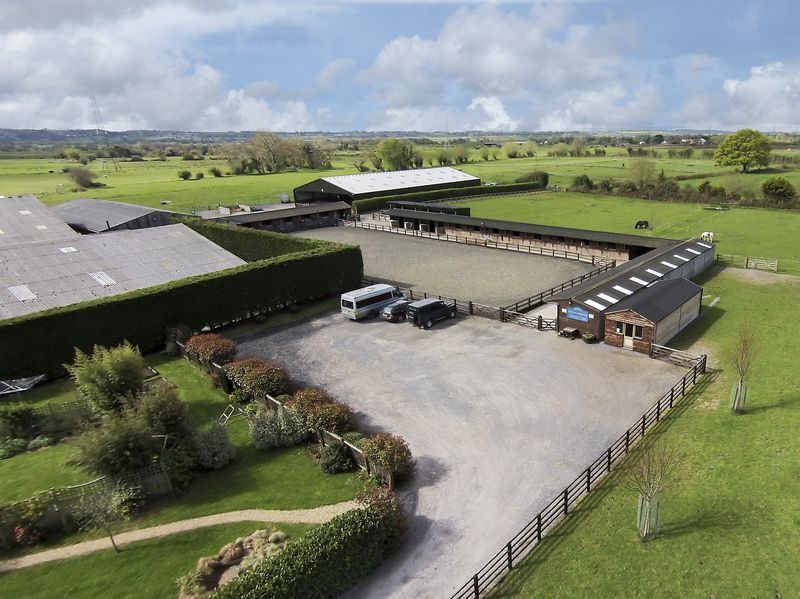 Aerial view of the yard, car park and outdoor arena